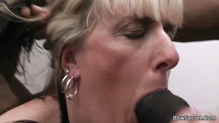 Blonde housewife gets serviced by a massive dark stud's meat pole