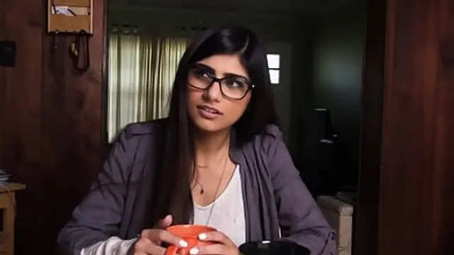 Mia Khalifa enjoys intense trio action with massive dicks